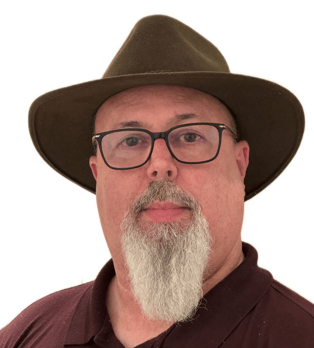 Headshot of the Web Detactive weating a brown hat and glasses.